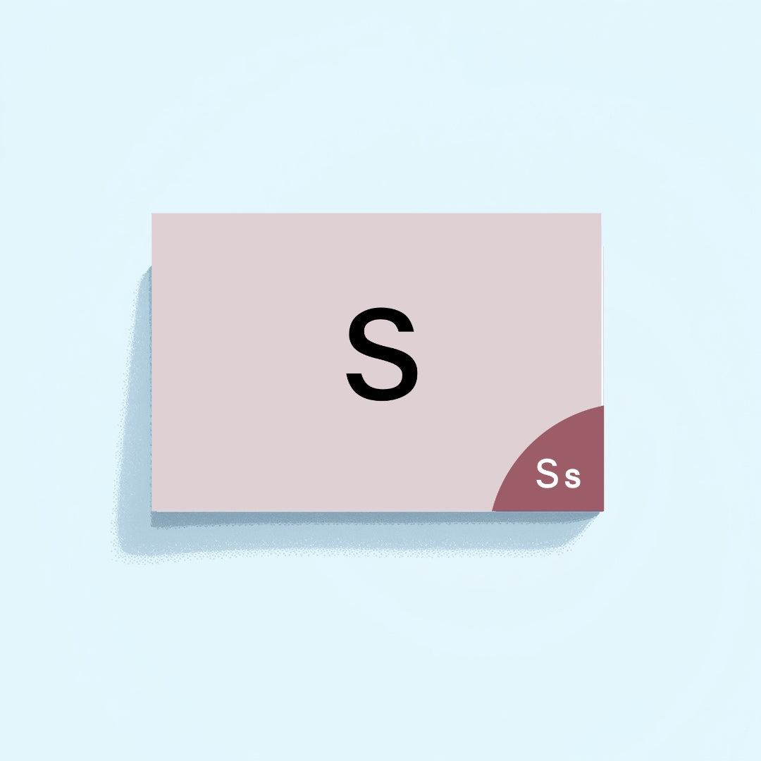 Card with letter 'S' on a light pink background